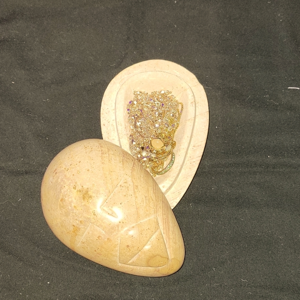 Stone carved jewelry box with jewelry